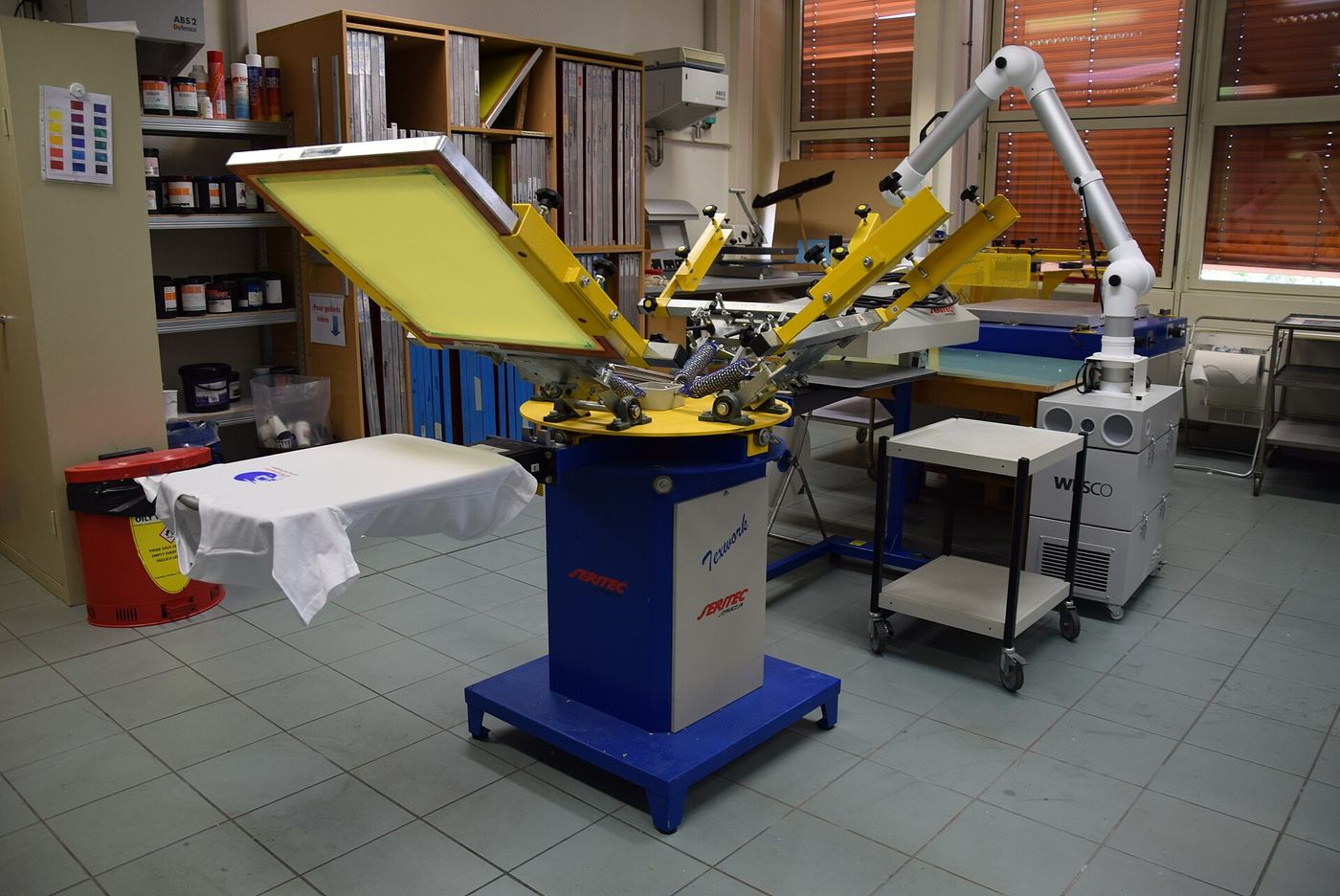 Screen-printing carousel press in a bright, tidy workshop